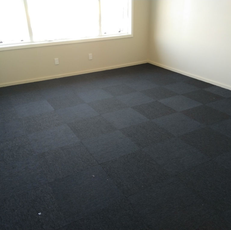 Luxury vinyl tile samples showing various textures and colours